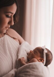 New mother holding her newborn, postpartum depression support in Salt Lake City