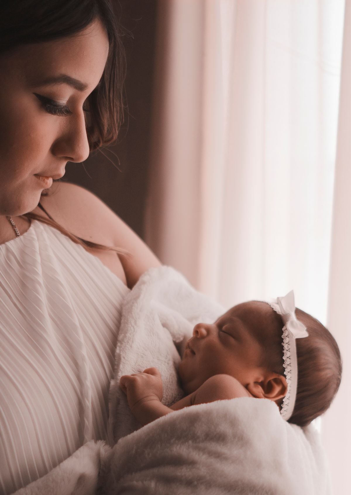 New mother holding her newborn, postpartum depression support in Salt Lake City